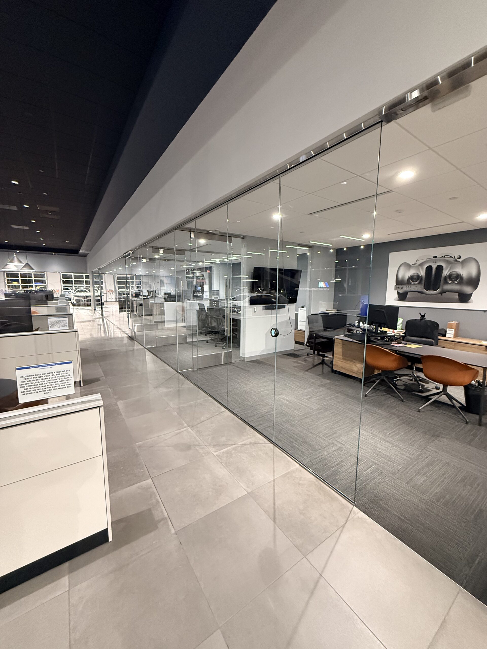Commercial window cleaning technician squeegeeing corporate architectural glass